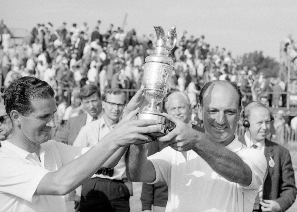 Roberto De Vicenzo lifts the Claret Jug after winning The Open in 1967